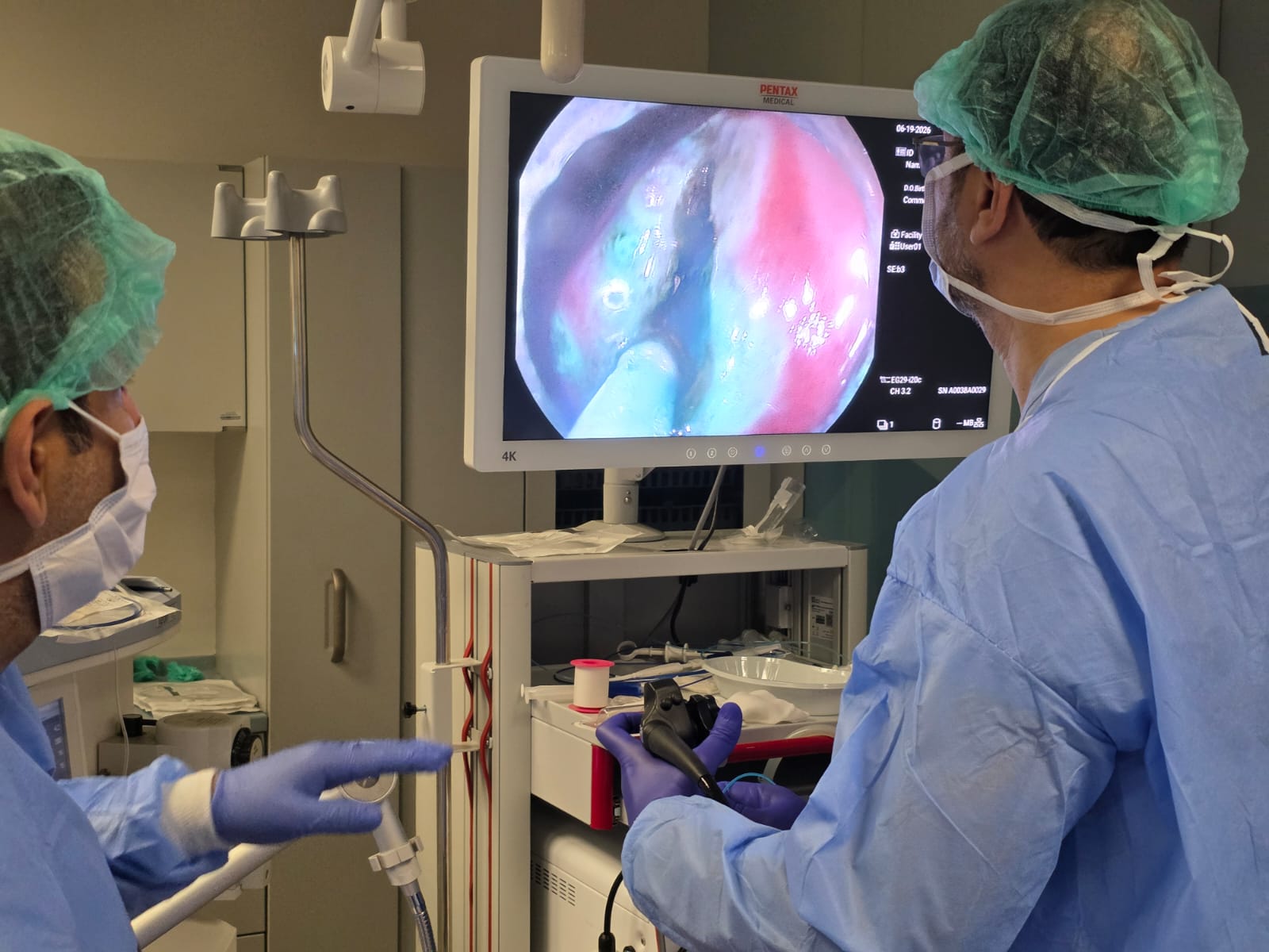 Trainee performing an endoscopic procedure under supervision.